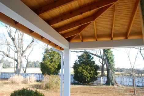 Wrap around porch with exposed cedar framing