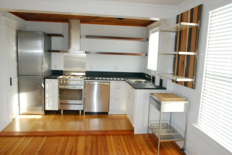 refinished floors and reclaimed walnut shelves