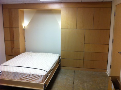 Murphy bed pulls down with LED octopus arm reading lights.